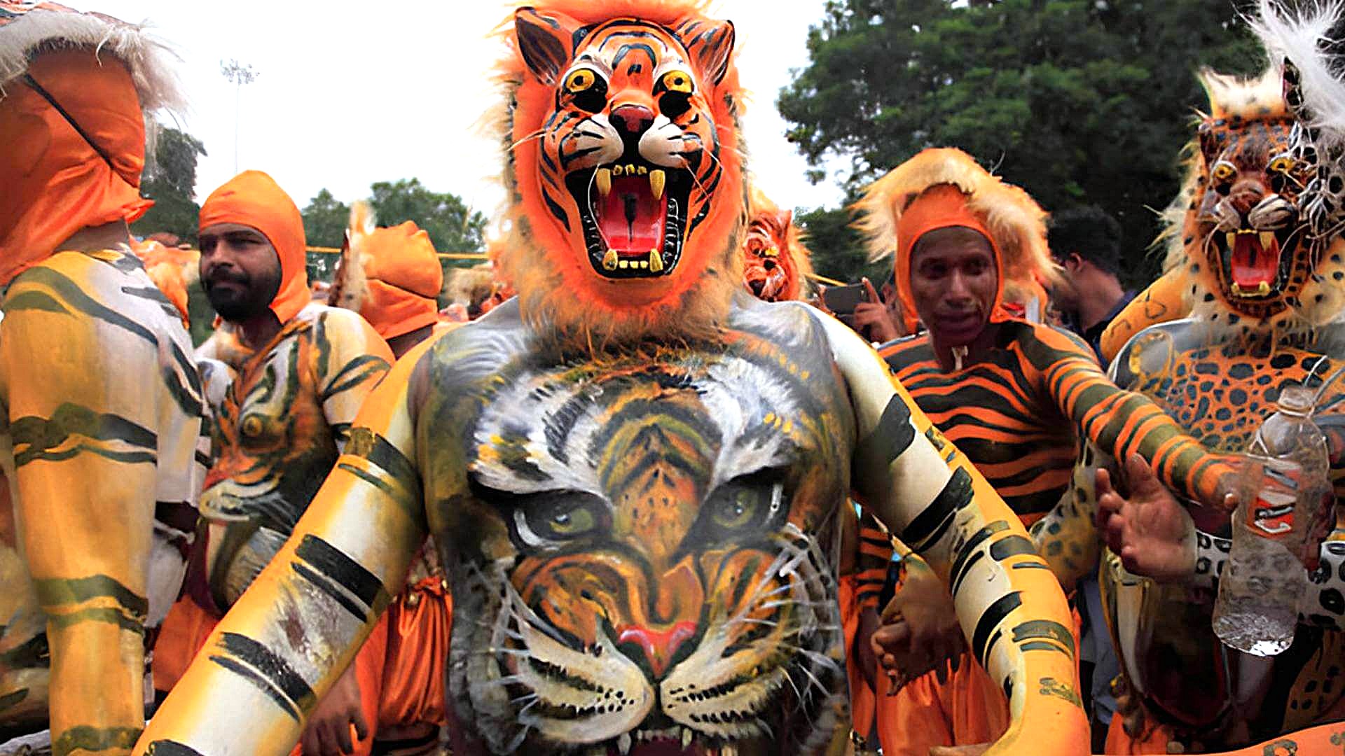 Tiger dance at Onam festival in Kerala India highlights traditional tiger costumes, intricate face paint, dynamic folk rituals reflecting Kerala’s rich cultural heritage in India. Tiger dance at Onam festival in Kerala India highlights traditional tiger costumes, intricate face paint, dynamic folk rituals reflecting Kerala’s rich cultural heritage in India.