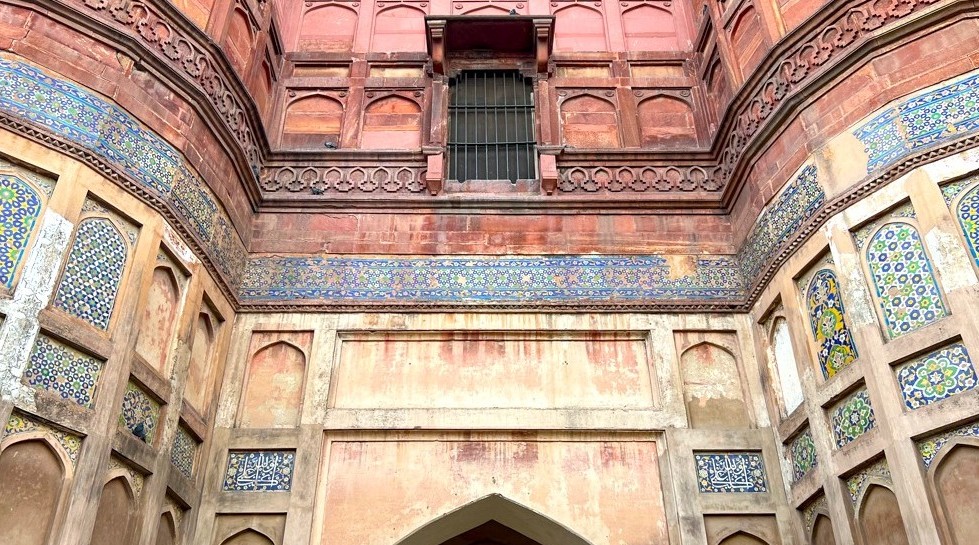 View of Sheesh Mahal at Agra Fort, showcasing intricate Mughal tile work and calligraphy, an iconic UNESCO World Heritage Site in Uttar Pradesh, India.