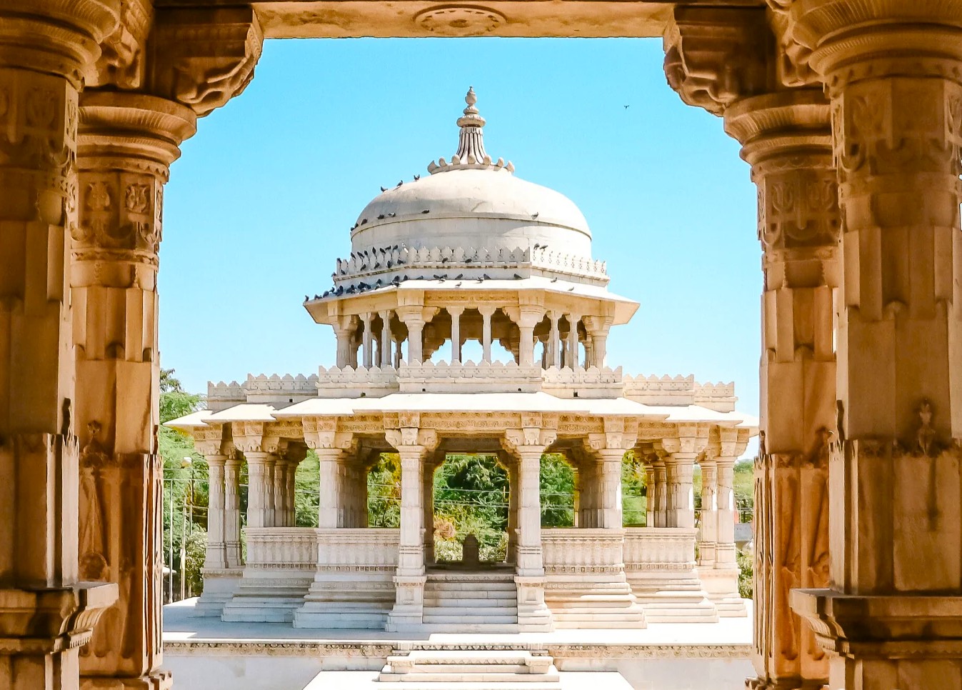 Discover Udaipur’s Ahar Cenotaphs in Rajasthan, India showcasing intricately carved marble memorials, serene outdoor gardens, Rajputana heritage architecture, ancient cultural history insights, guided tours, photogenic landmarks, spiritual ambiance, historical significance.
