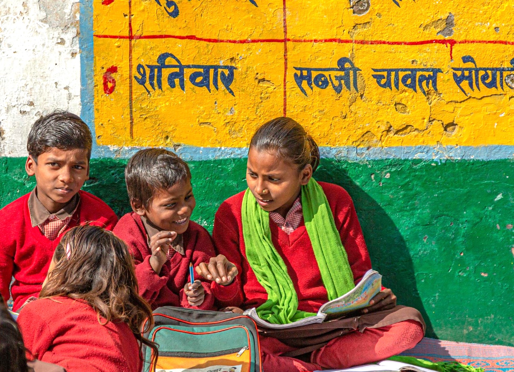 Vibrant photo of local school children in Aihole, India, capturing community life near the heritage sites of Badami and the Pattadakal UNESCO temples. Vibrant photo of local school children in Aihole, India, capturing community life near the heritage sites of Badami and the Pattadakal UNESCO temples.