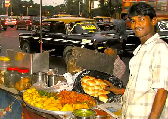 Savor the simple, delicious relationship between travelers and local street food near Aliyar Dam on the Coimbatore to Kodaikanal road trip. This culinary connection is a highlight of exploring the Palani Hills and UNESCO Western Ghats in Tamil Nadu, India. Savor the simple, delicious relationship between travelers and local street food near Aliyar Dam on the Coimbatore to Kodaikanal road trip. This culinary connection is a highlight of exploring the Palani Hills and UNESCO Western Ghats in Tamil Nadu, India.