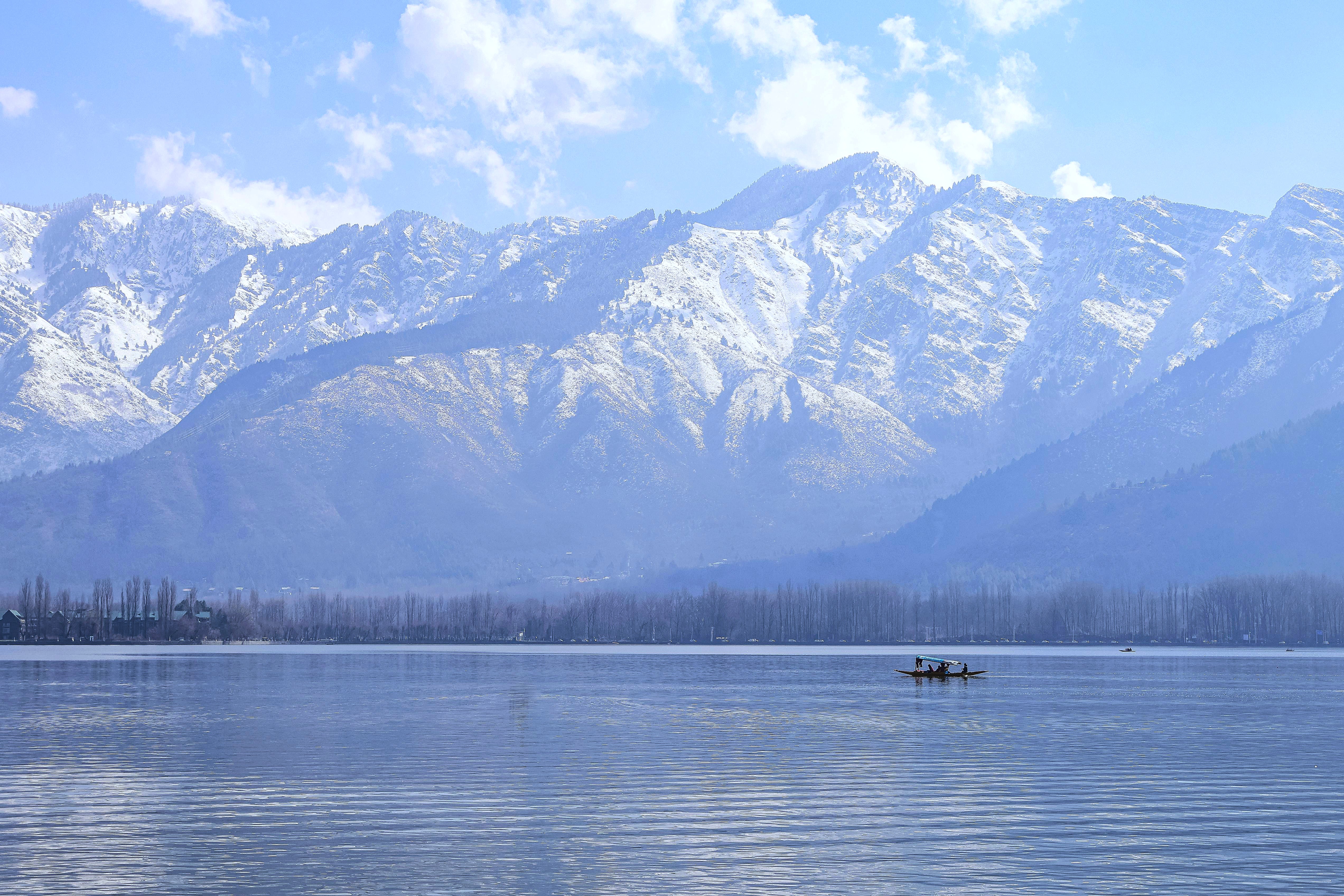 Relax on a Kashmir lake boat ride with Himalayan views, a scenic highlight of India tours that also visit Delhi, Mumbai, Varanasi, and the Aurangabad-UNESCO Ellora caves. Relax on a Kashmir lake boat ride with Himalayan views, a scenic highlight of India tours that also visit Delhi, Mumbai, Varanasi, and the Aurangabad-UNESCO Ellora caves.