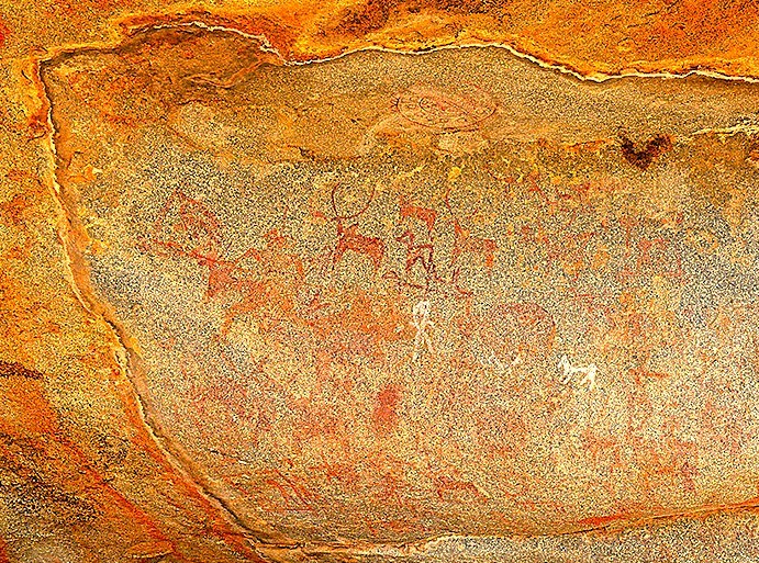 Explore the ancient Neolithic cave paintings near Anegundi in Karnataka, India, showcasing prehistoric art just a stone's throw from the Hampi UNESCO site. This ancient heritage site is part of a landscape that includes the Queen's Baths, Vittala Temple, Elephant Stables, and the verdant Anegundi Rice Fields. Explore the ancient Neolithic cave paintings near Anegundi in Karnataka, India, showcasing prehistoric art just a stone's throw from the Hampi UNESCO site. This ancient heritage site is part of a landscape that includes the Queen's Baths, Vittala Temple, Elephant Stables, and the verdant Anegundi Rice Fields.