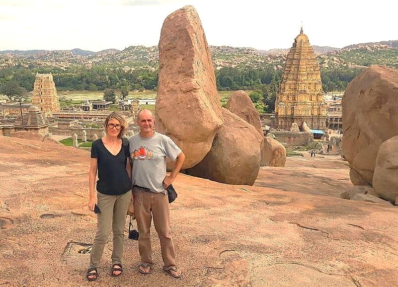 Tourists enjoy the panoramic view of the Hampi UNESCO site from a viewpoint near Anegundi Village in Karnataka, India, a historic landscape renowned for incredible monuments including the Queen's Baths, the magnificent Vittala Temple, and the grand Elephant Stables. Tourists enjoy the panoramic view of the Hampi UNESCO site from a viewpoint near Anegundi Village in Karnataka, India, a historic landscape renowned for incredible monuments including the Queen's Baths, the magnificent Vittala Temple, and the grand Elephant Stables.
