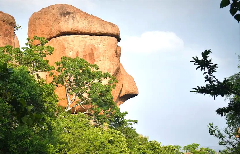 The unique, face-like rock formations are a natural wonder in Anegundi Village, Karnataka, India, defining the surreal landscape surrounding the Hampi UNESCO site, a region celebrated for architectural marvels like the Queen's Baths, the magnificent Vittala Temple, and the grand Elephant Stables. The unique, face-like rock formations are a natural wonder in Anegundi Village, Karnataka, India, defining the surreal landscape surrounding the Hampi UNESCO site, a region celebrated for architectural marvels like the Queen's Baths, the magnificent Vittala Temple, and the grand Elephant Stables.