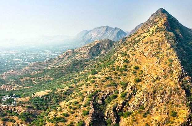 The rugged beauty of the Aravali Hills, a proposed UNESCO natural heritage site in Rajasthan, India, stretching across the landscape near the famous cultural UNESCO cities of Jodhpur, Jaipur, and Udaipur. The rugged beauty of the Aravali Hills, a proposed UNESCO natural heritage site in Rajasthan, India, stretching across the landscape near the famous cultural UNESCO cities of Jodhpur, Jaipur, and Udaipur.