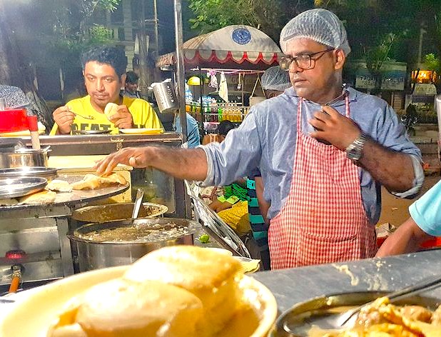 Enjoying street food at the Goa Flee Market is a popular experience in India, complementing visits to nearby beaches, historic Fontainhas, and the Old Goa-Bom Jesus Basilica-Unesco churches. Enjoying street food at the Goa Flee Market is a popular experience in India, complementing visits to nearby beaches, historic Fontainhas, and the Old Goa-Bom Jesus Basilica-Unesco churches.