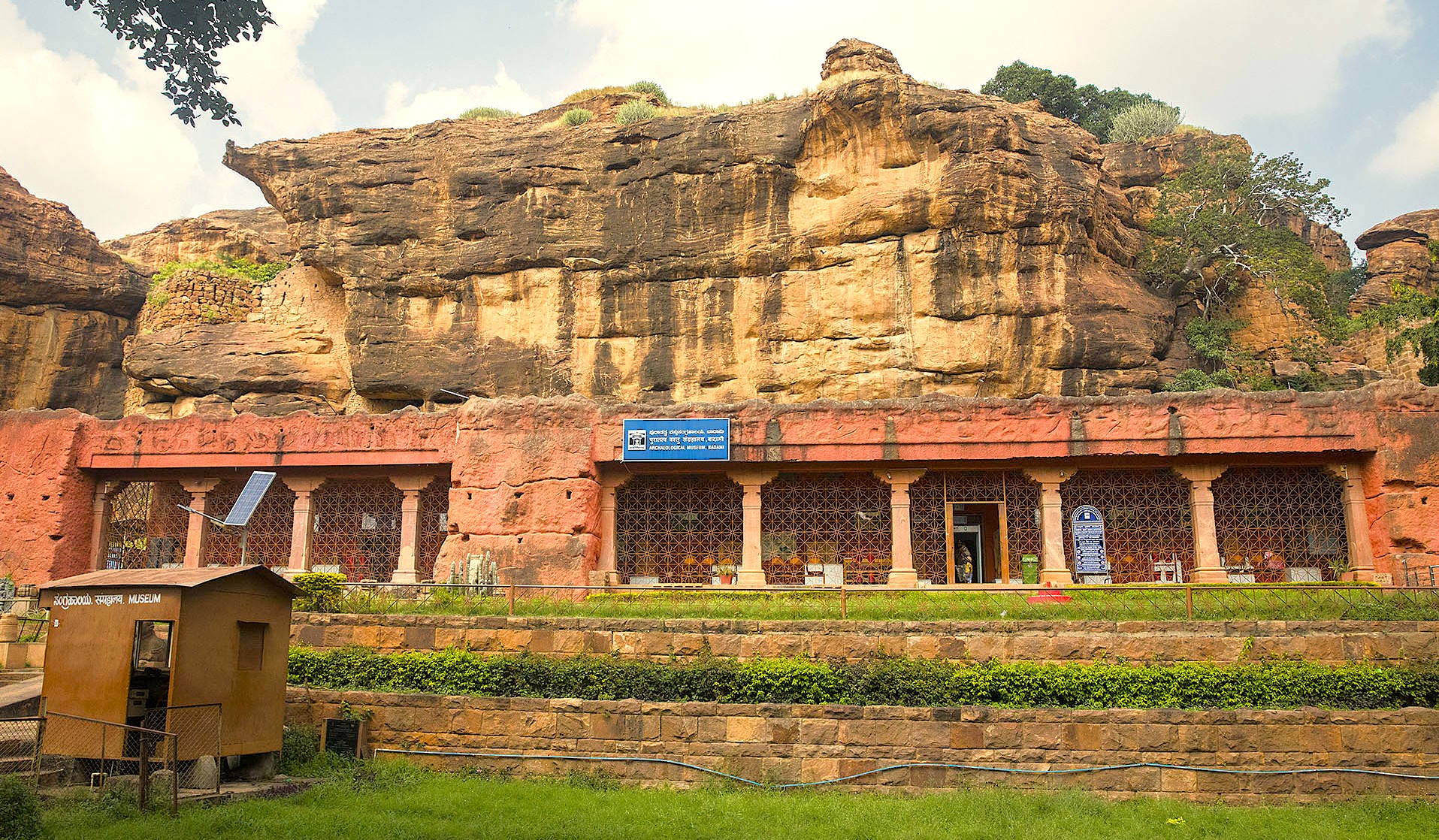 The Badami Archaeological Museum, nestled at the base of dramatic red sandstone cliffs in Badami, Karnataka, India, preserves priceless sculptures from the Chalukya dynasty. This key heritage site, located near the Pattadakal UNESCO World Heritage complex, is essential for understanding the region's rich history. The Badami Archaeological Museum, nestled at the base of dramatic red sandstone cliffs in Badami, Karnataka, India, preserves priceless sculptures from the Chalukya dynasty. This key heritage site, located near the Pattadakal UNESCO World Heritage complex, is essential for understanding the region's rich history.