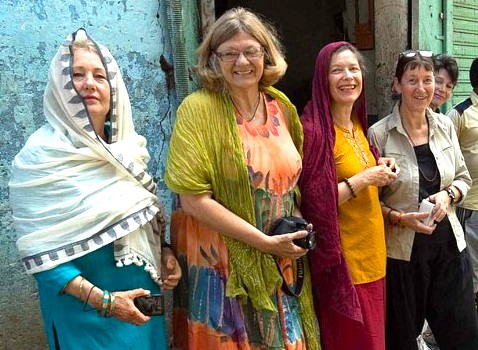 Here is an SEO-optimized sentence based on your request:  A group of smiling female international tourists enjoys a cultural tour in Badami, Karnataka, India, a historic town renowned for its ancient temples. This popular travel destination, home to the Badami Archaeological Museum, is located near the celebrated Pattadakal UNESCO World Heritage site. Here is an SEO-optimized sentence based on your request:  A group of smiling female international tourists enjoys a cultural tour in Badami, Karnataka, India, a historic town renowned for its ancient temples. This popular travel destination, home to the Badami Archaeological Museum, is located near the celebrated Pattadakal UNESCO World Heritage site.