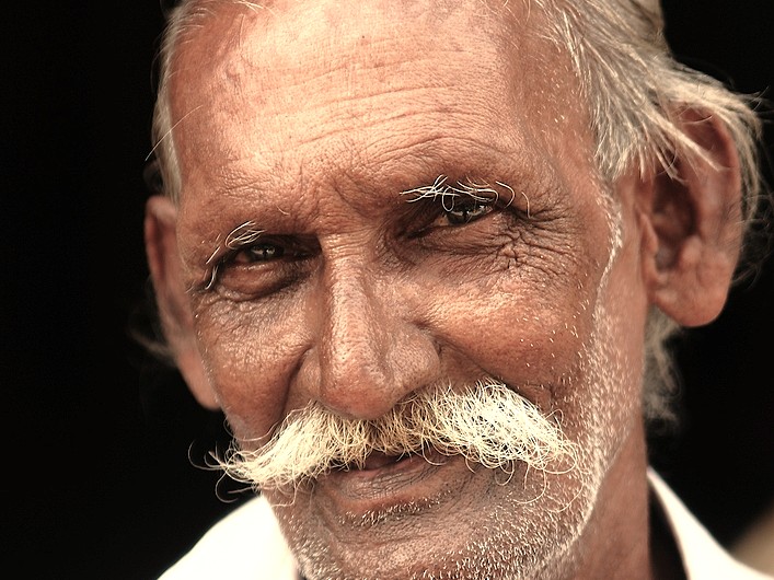 A striking portrait of an elderly man with a traditional white mustache in Badami, Karnataka, India, representing the local culture near the Badami Fort and Pattadarkel-Unesco site. A striking portrait of an elderly man with a traditional white mustache in Badami, Karnataka, India, representing the local culture near the Badami Fort and Pattadarkel-Unesco site.