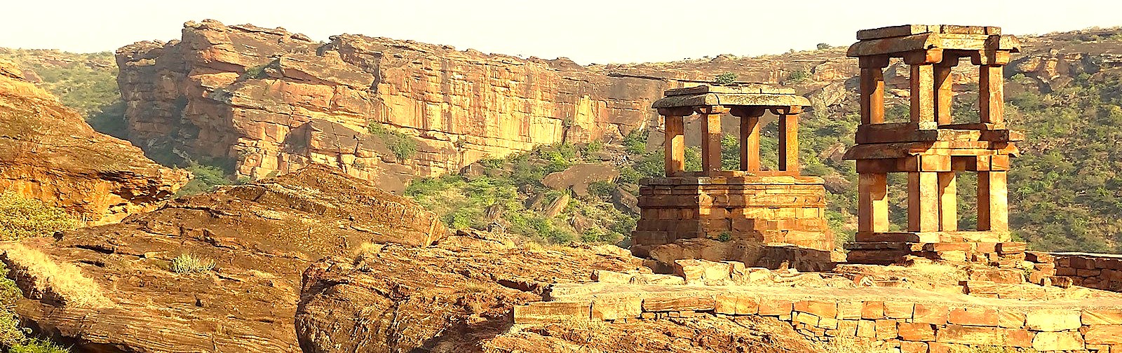 Discover the stunning red sandstone landscape of Badami in Karnataka, India, a historic town famed for its own rock-cut temples. It is located near the magnificent Pattadakal UNESCO World Heritage site, offering breathtaking views and a deep dive into ancient Indian history.