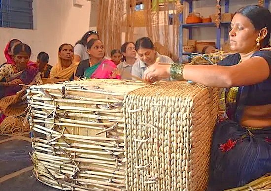 Local women weavers at the Anegundi Banana Fibre Workshop in Karnataka, India, showcase traditional craftsmanship, offering a unique cultural experience for visitors exploring the nearby Hampi UNESCO site, a region celebrated for historical wonders like the Queen's Baths, Vittala Temple, and the Elephant Stables. Local women weavers at the Anegundi Banana Fibre Workshop in Karnataka, India, showcase traditional craftsmanship, offering a unique cultural experience for visitors exploring the nearby Hampi UNESCO site, a region celebrated for historical wonders like the Queen's Baths, Vittala Temple, and the Elephant Stables.