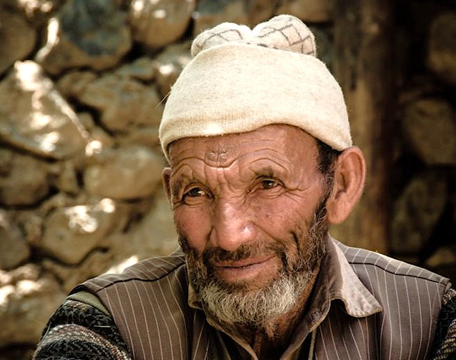 Portrait of a local Kashmiri man at the Bandashar Tomb in Srinagar, Jammu and Kashmir, a historic site near saffron fields, Aru Valley, and Betaab Valley.