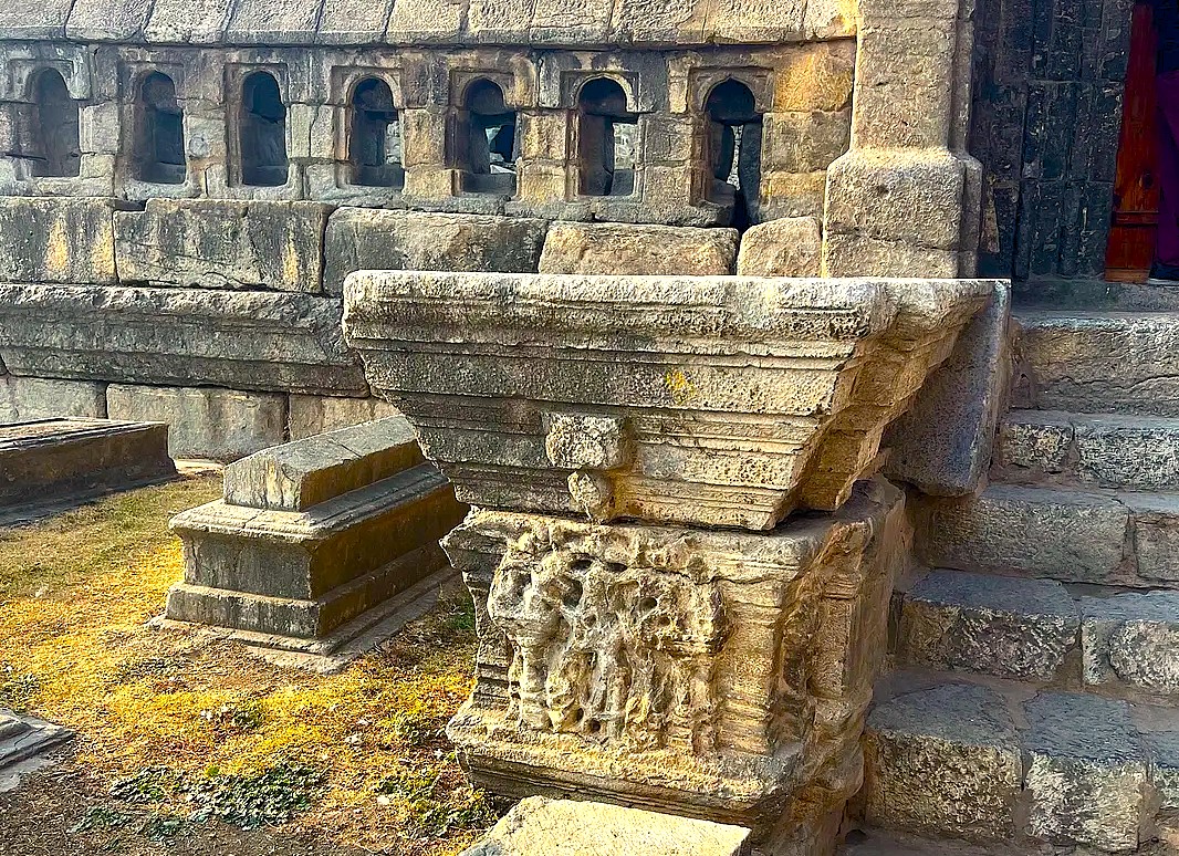 Ancient stone carvings and steps at the Bandashar Tomb in Srinagar, Jammu and Kashmir, a historic site near saffron fields, Aru Valley, and Betaab Valley.