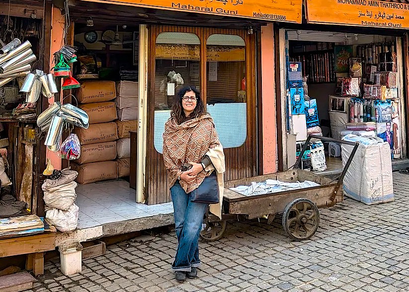 A tourist explores a local market in Srinagar, Jammu and Kashmir, a city near the Bandashar Tomb, saffron fields, Aru Valley, and Betaab Valley.