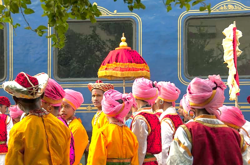 Vibrant scene of children in traditional Rajasthani attire celebrating near Aurangabad’s UNESCO heritage, with glimpses of Ellora and Ajanta Caves and the iconic marble Bibi Ka Maqbara in Maharashtra, India.