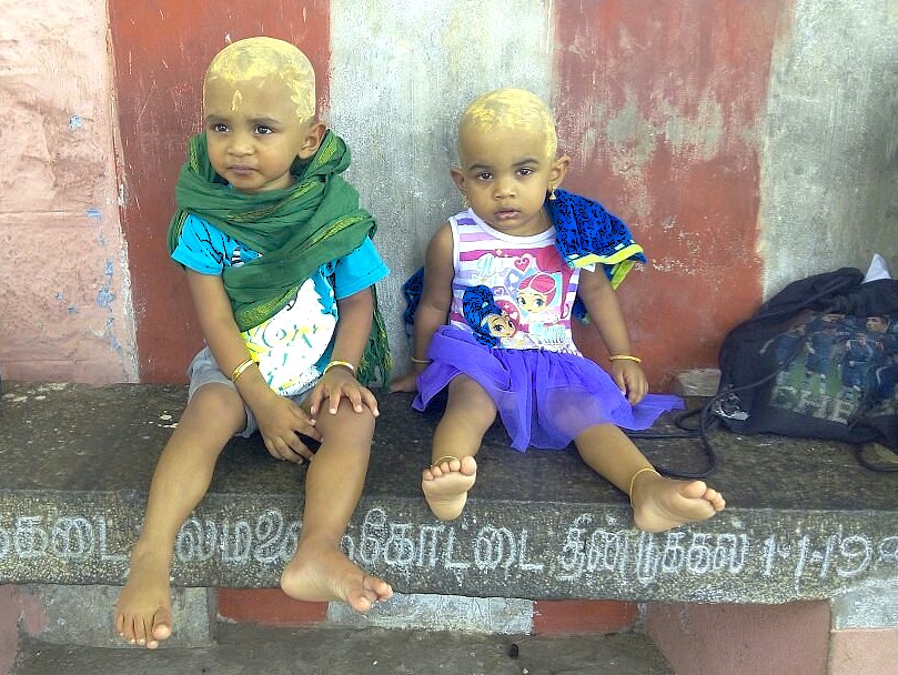 “Vibrant Pushka Brahma Temple in Rajasthan, India, welcomes pilgrims between Jaipur and Agra with striking blue pillars, ornate red domes, rituals, and spiritual ambiance en route to the Taj Mahal.”