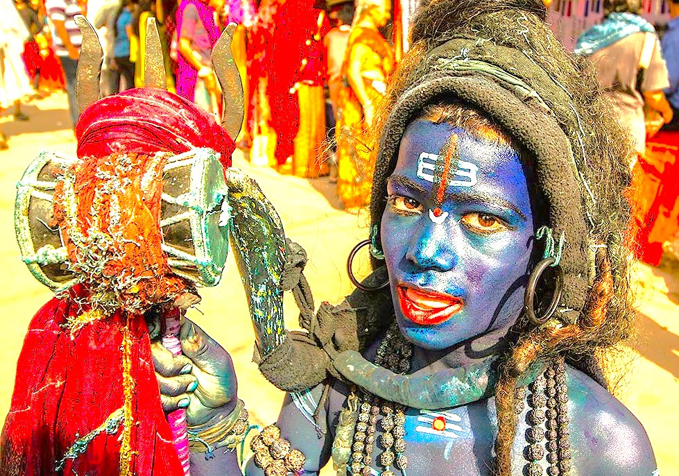 A boy's spiritual relationship with Hindu tradition shines at a festival in Uttar Pradesh, India, a cultural experience for tourists visiting Agra's Taj Mahal, Agra Fort, the Unesco site Fatehpur Sikri, Keoladeo National Park, and the sacred cities of Varanasi and Mathura.