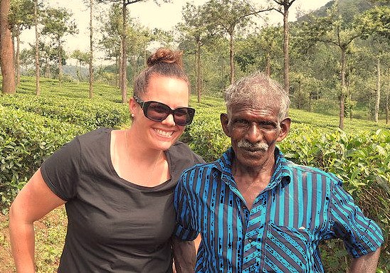 A tourist poses with a local man in Jammu and Kashmir, a region near Srinagar, saffron fields, Aru Valley, Betaab Valley, and Chakau Arts Emporium, famed for walnut wood art.