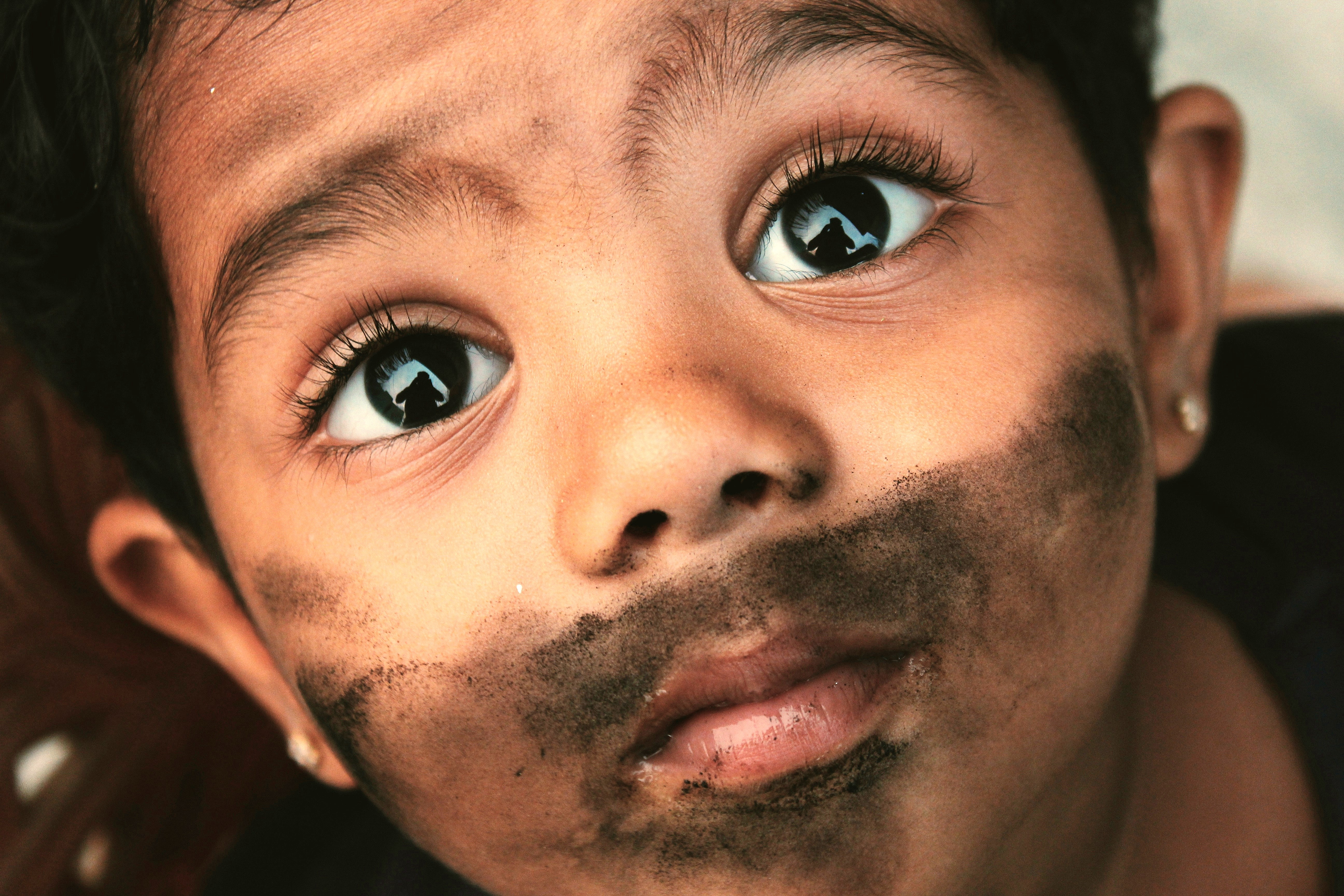 A child in Rajasthan, India, near the Chand Baori Step well in Abernani, a site close to Jaipur and UNESCO heritage like the Taj Mahal in Agra.