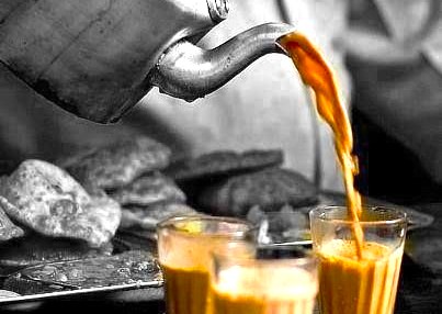 Authentic masala chai being poured at Old Delhi's Chandni Chowk Spice Market, a memorable taste of India for tourists exploring UNESCO sites like the Red Fort, Qutub Minar, and Humayun's Tomb. Authentic masala chai being poured at Old Delhi's Chandni Chowk Spice Market, a memorable taste of India for tourists exploring UNESCO sites like the Red Fort, Qutub Minar, and Humayun's Tomb.