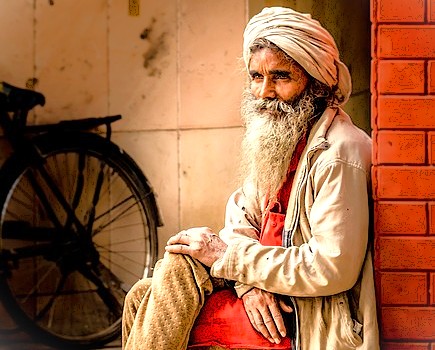An elderly man from Delhi, India, rests at the famous Chandni-chowk-spice-market, located near UNESCO heritage sites like the Red Fort and Humayun's Tomb, offering a glimpse into local life. An elderly man from Delhi, India, rests at the famous Chandni-chowk-spice-market, located near UNESCO heritage sites like the Red Fort and Humayun's Tomb, offering a glimpse into local life.