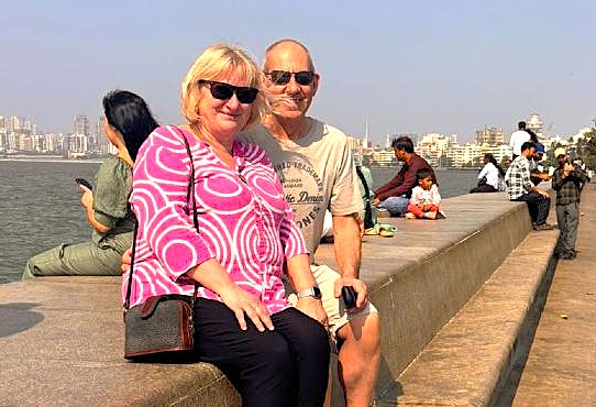 Vibrant street vendor at Chowpatty Beach in Mumbai, Mahapradesh, India offers an array of spiced peanuts, crunchy seeds and local dried fruits, inviting visitors to savor authentic seaside snack flavors.