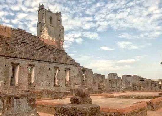 The historic brick ruins and tower of the Church of Saint Augustine Old Goa, one of the Old Goa-Unesco churches, a popular heritage site in Goa, India, near its beaches. The historic brick ruins and tower of the Church of Saint Augustine Old Goa, one of the Old Goa-Unesco churches, a popular heritage site in Goa, India, near its beaches.