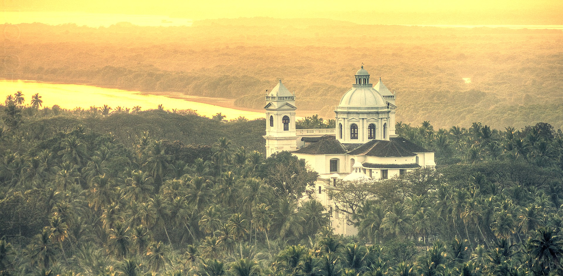 The historic Church of Saint Cajetan in Old Goa, India, seen in a beautiful landscape, is a UNESCO site near the Bom Jesus Basilica and a popular visit for tourists from Anjuna Beach Flea Market. The historic Church of Saint Cajetan in Old Goa, India, seen in a beautiful landscape, is a UNESCO site near the Bom Jesus Basilica and a popular visit for tourists from Anjuna Beach Flea Market.
