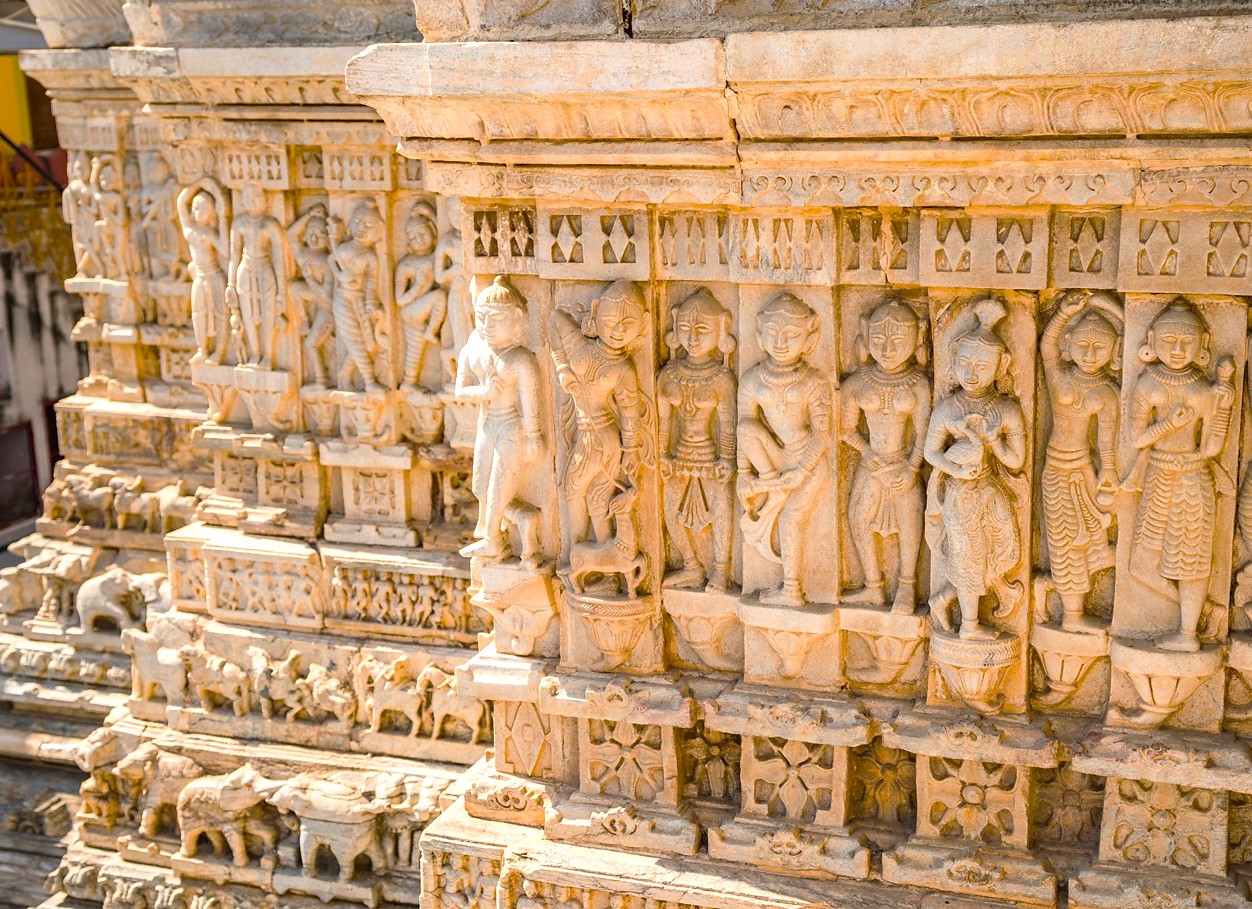 In Udaipur’s City Palace, Rajasthan, India, intricate sandstone carvings depict mythological figures, ornate floral motifs, historic architectural detail, artisanal traditional stonecraft, devotional symbolism, exquisite royal heritage, and timeless cultural artistry. In Udaipur’s City Palace, Rajasthan, India, intricate sandstone carvings depict mythological figures, ornate floral motifs, historic architectural detail, artisanal traditional stonecraft, devotional symbolism, exquisite royal heritage, and timeless cultural artistry.