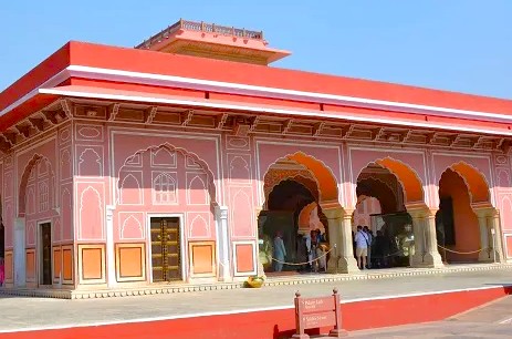Spectacular UNESCO heritage City Palace in Jaipur, Rajasthan, India showcases exquisite Rajasthani and Mughal architecture, vibrant pink sandstone façades, intricate ornate courtyards, historic museums, lavish royal galleries, and landscaped gardens.