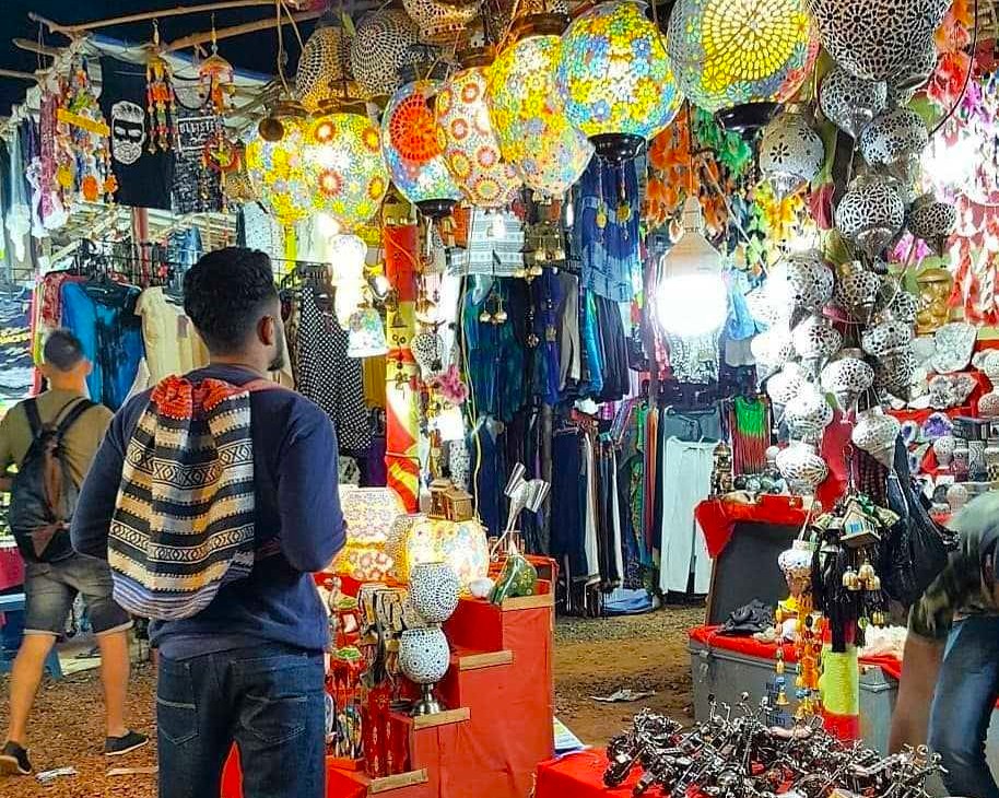 Colorful night bazaar beneath Jodhpur’s historic Clockwork Tower in the Blue City of Rajasthan, India, features glowing mosaic lanterns, handcrafted textiles, vibrant stalls, curious tourists, and bustling local shopping scene. Colorful night bazaar beneath Jodhpur’s historic Clockwork Tower in the Blue City of Rajasthan, India, features glowing mosaic lanterns, handcrafted textiles, vibrant stalls, curious tourists, and bustling local shopping scene.