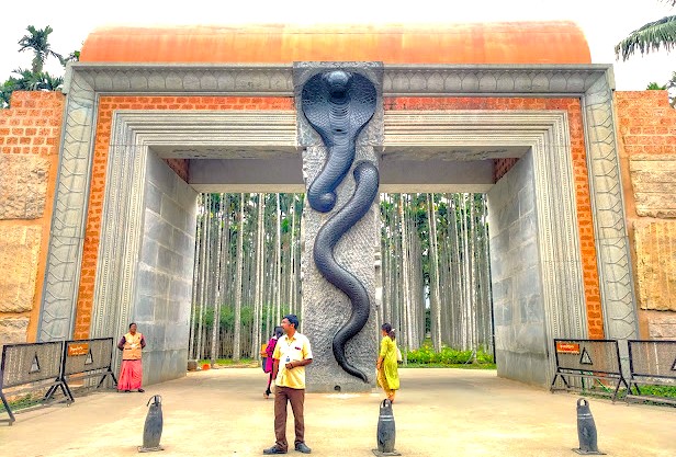 Stunning snake sculpture entrance gate in Bangalore, Karnataka, India invites road trip explorers near Mysore Palace en route to Tamil Nadu, showcasing immersive wildlife sanctuary ambiance and cultural heritage architecture. Stunning snake sculpture entrance gate in Bangalore, Karnataka, India invites road trip explorers near Mysore Palace en route to Tamil Nadu, showcasing immersive wildlife sanctuary ambiance and cultural heritage architecture.