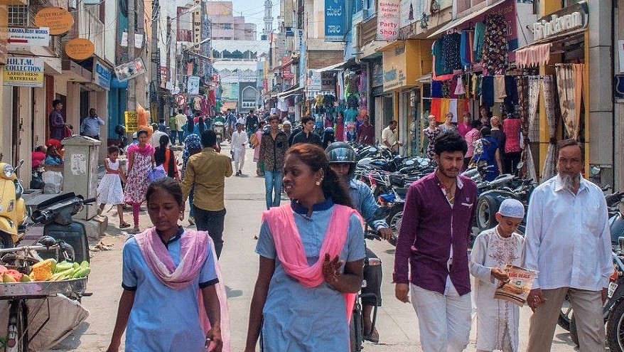 Bustling Commercial Street in Bangalore, Karnataka, India, near Mysore Palace, teeming with diverse shoppers in vibrant attire, local vendors selling fruits and clothes, offering authentic shopping and dining experiences for cultural tourists and urban explorers. Bustling Commercial Street in Bangalore, Karnataka, India, near Mysore Palace, teeming with diverse shoppers in vibrant attire, local vendors selling fruits and clothes, offering authentic shopping and dining experiences for cultural tourists and urban explorers.
