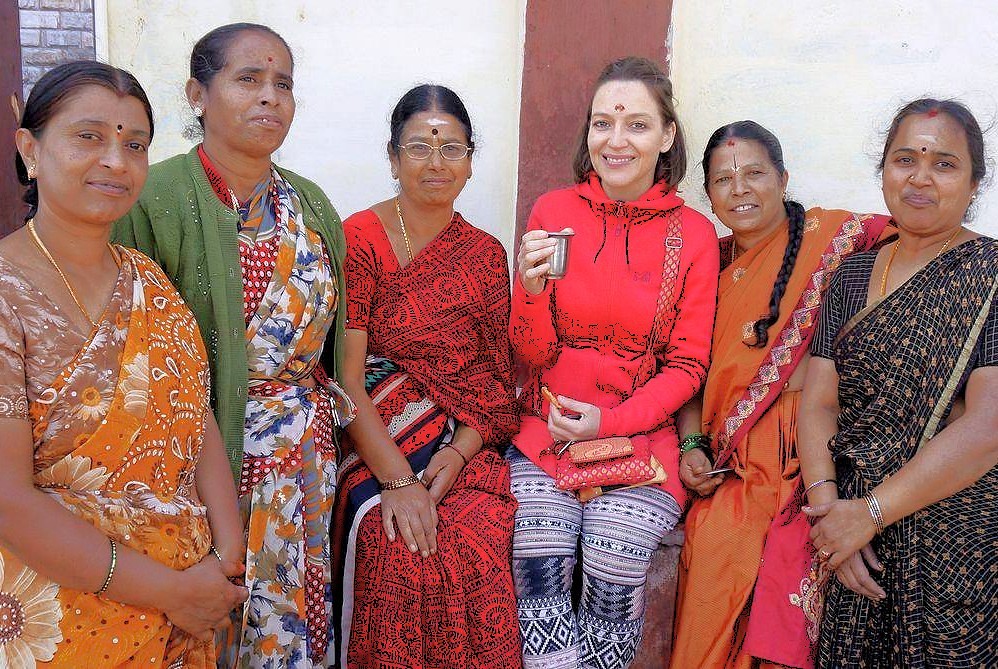 Group of women in traditional sarees enjoying local hospitality at historic Daulatabad Fort near Aurangabad, Maharashtra, India, exploring UNESCO World Heritage Elora and Ajanta Caves, showcasing vibrant cultural heritage ties.