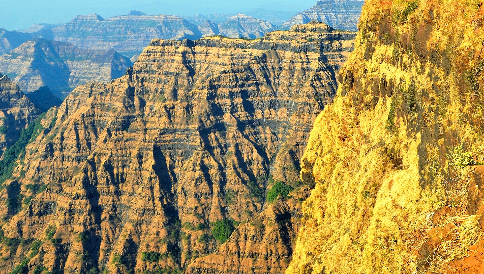 Explore the majestic Deccan Plateau in Karnataka, India, bordering UNESCO’s Western Ghats, where dramatic rock formations, lush forests, unique wildlife habitats, ancient cultural landmarks offer immersive unforgettable eco-tourism adventure experiences.