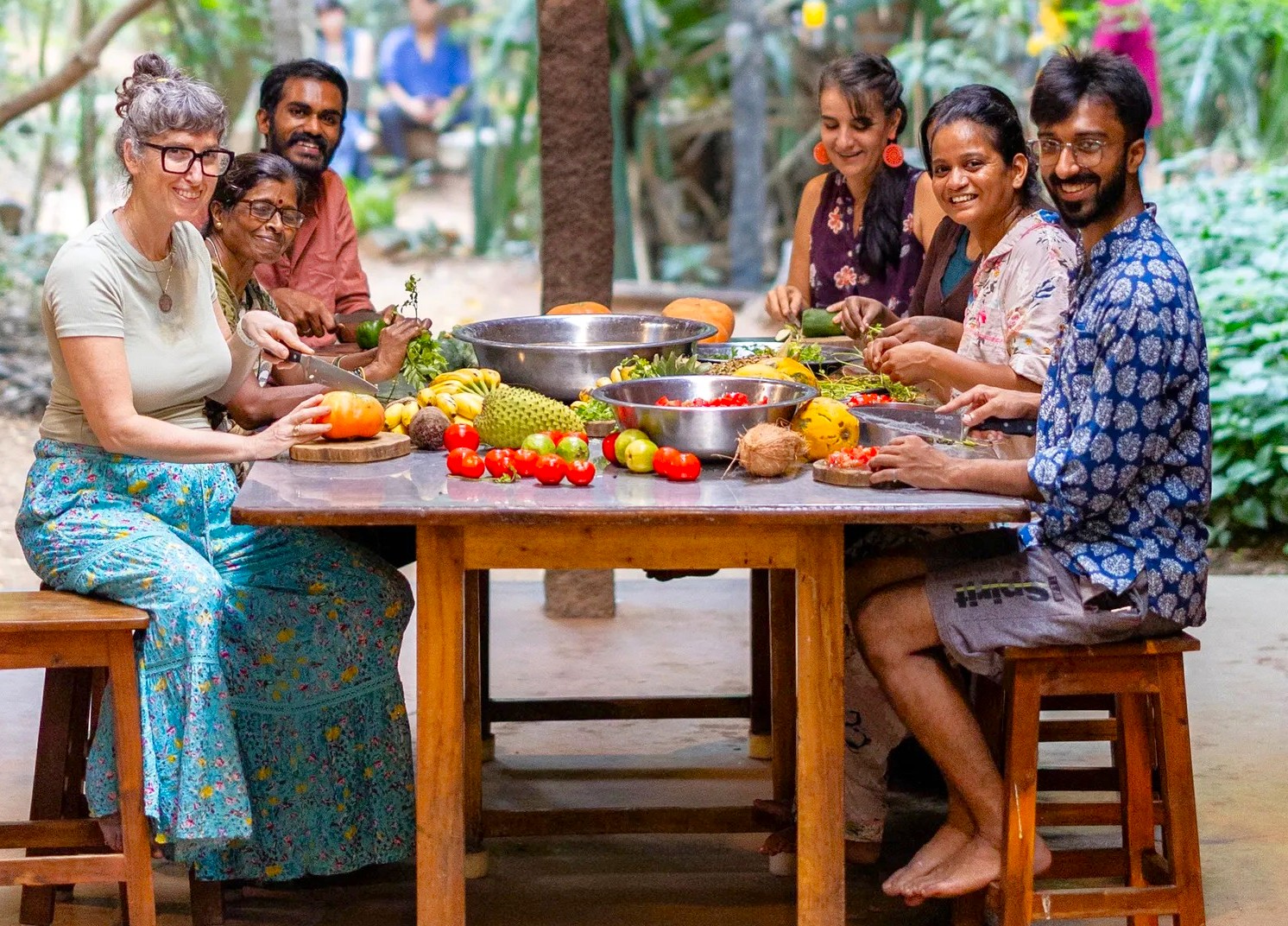 Tourists and local guides pose in vibrant scarves at Kochi’s historic Dhoby Khana Laundry site in Kerala, South India, showcasing cultural immersion, heritage architecture, friendly interaction, and colorful traditional attire. Tourists and local guides pose in vibrant scarves at Kochi’s historic Dhoby Khana Laundry site in Kerala, South India, showcasing cultural immersion, heritage architecture, friendly interaction, and colorful traditional attire.