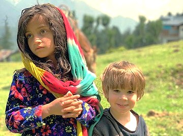 Two beautiful Kashmiri children reflect the local culture and life in the Himalayas, near landmarks like Shankaracharya Hill and Sinthan Top in Srinagar, India. Two beautiful Kashmiri children reflect the local culture and life in the Himalayas, near landmarks like Shankaracharya Hill and Sinthan Top in Srinagar, India.