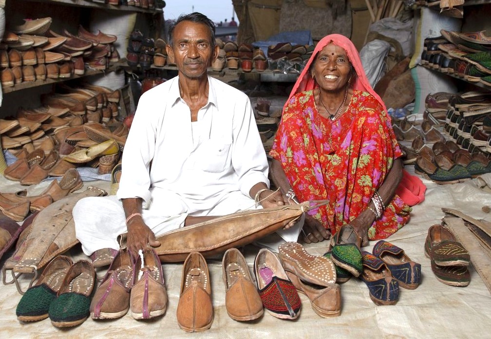 Experience the enduring relationship between local artisans and their craft, like this couple selling handmade shoes near Echo Point, Munnar. This authentic connection is a highlight of a South India tour through the UNESCO Western Ghats, near Madurai and Kochi. Experience the enduring relationship between local artisans and their craft, like this couple selling handmade shoes near Echo Point, Munnar. This authentic connection is a highlight of a South India tour through the UNESCO Western Ghats, near Madurai and Kochi.