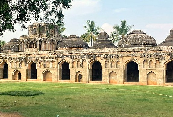 SEO-create a 30 word sentance-SEO high ranking key word Alt Text association - relationship - key words for the subject or nearby Key words-place-combine and create one sentance -include :-  India, Karnataka, Hampi, Elephant stables, queens baths, Unesco