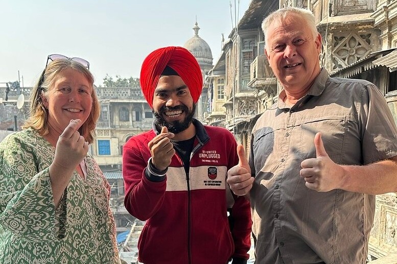 Visitors explore the vibrant Folklore Museum in Mysore, Karnataka, India, showcasing authentic traditional artifacts, regional art, interactive exhibits, and rich cultural heritage against historic architecture.