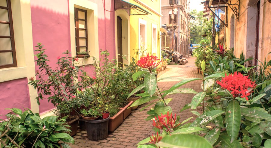 A colorful street in Fontainhas, the Portuguese Quarter in India, is a must-see along with the Goa Flea Market, beaches, and the Old Goa-Bom Jesus Bassilica-Unesco churches. A colorful street in Fontainhas, the Portuguese Quarter in India, is a must-see along with the Goa Flea Market, beaches, and the Old Goa-Bom Jesus Bassilica-Unesco churches.