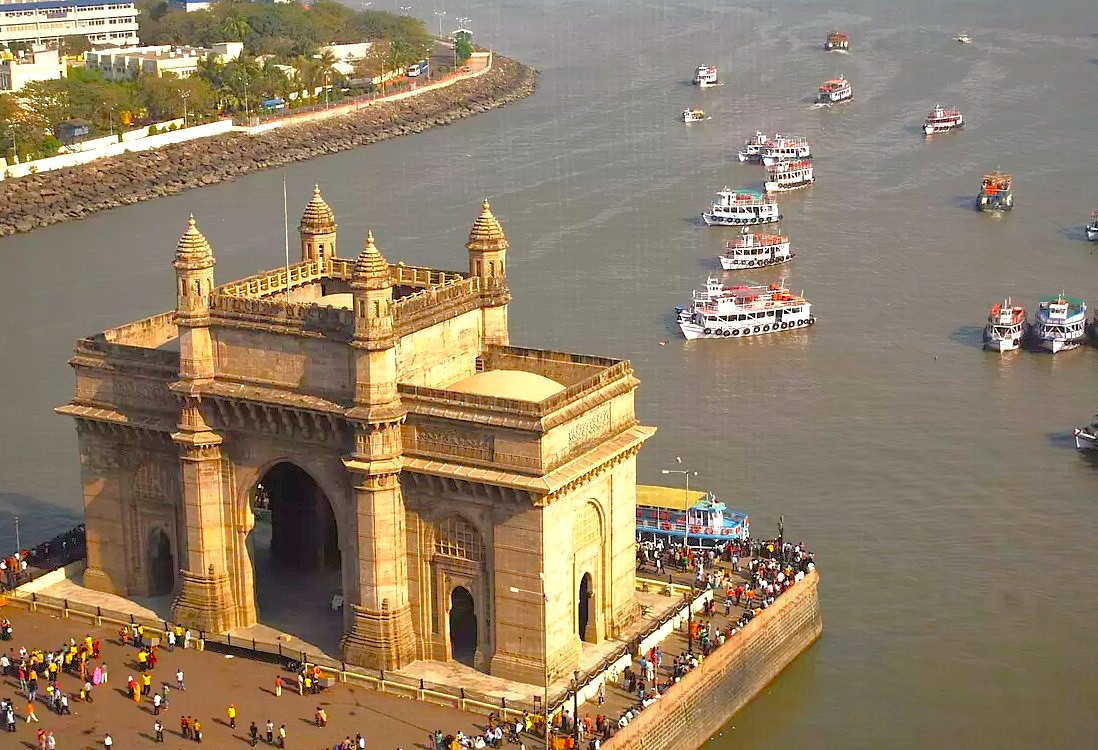 Visitors at the historic Gateway of India in Mumbai board ferries to the ancient UNESCO Elephanta Caves, often combining this heritage trip with a cultural tour of Dharavi Slums. Visitors at the historic Gateway of India in Mumbai board ferries to the ancient UNESCO Elephanta Caves, often combining this heritage trip with a cultural tour of Dharavi Slums.