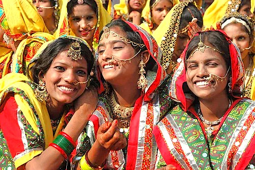 Vibrant local women in traditional attire celebrate cultural heritage near Gautala Wildlife Sanctuary Safari, Aurangabad, Maharashtra, India, with colorful festivals reflecting community ties to UNESCO’s historic Ellora and Ajanta Caves.