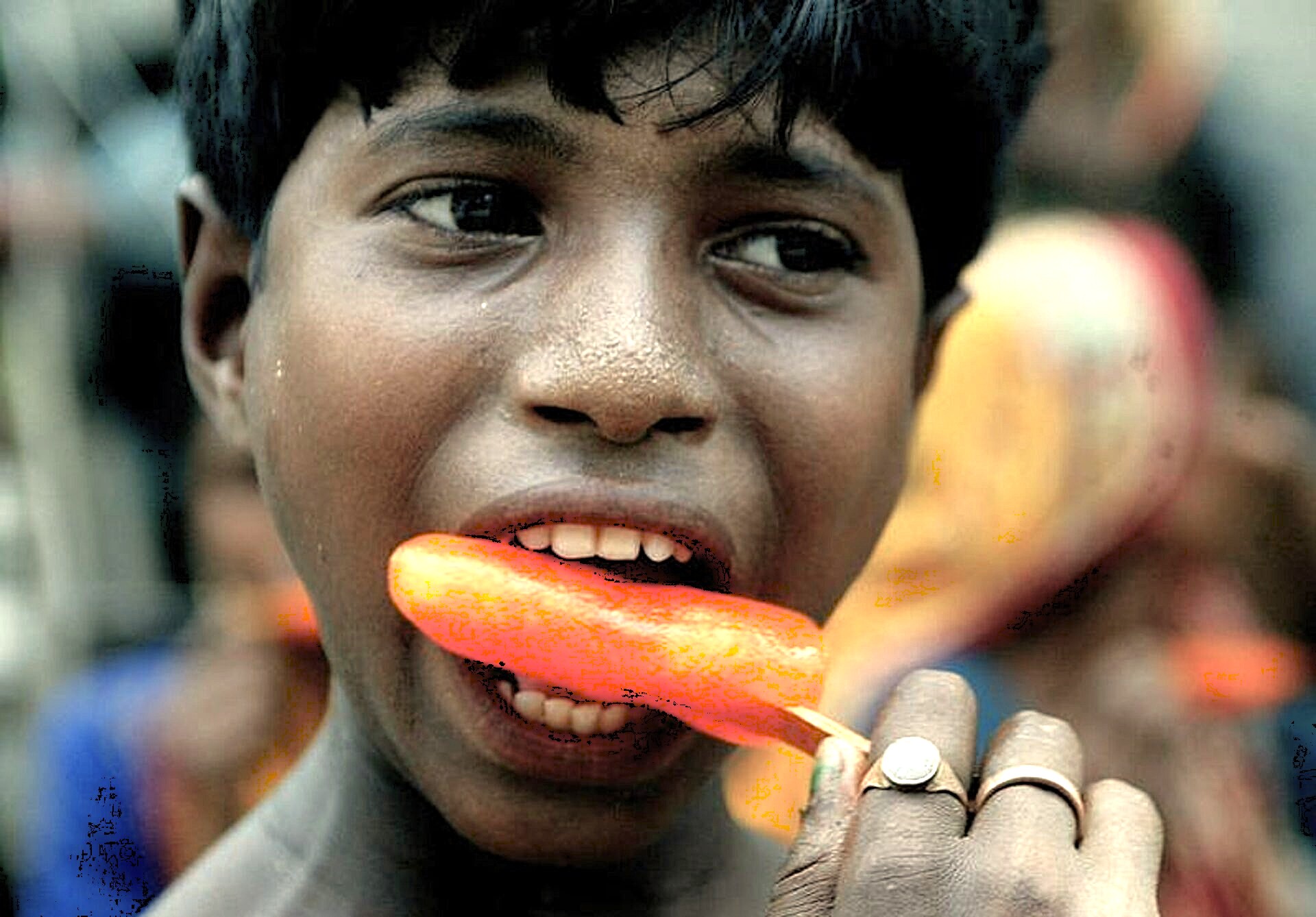 A local boy eats an ice lolly near Gavipuram Cave Temple in Bangalore, Karnataka, India, a site near Tipu Sultan Palace ('Tiger of Mysore') visited by tourists near Mysore Palace. A local boy eats an ice lolly near Gavipuram Cave Temple in Bangalore, Karnataka, India, a site near Tipu Sultan Palace ('Tiger of Mysore') visited by tourists near Mysore Palace.