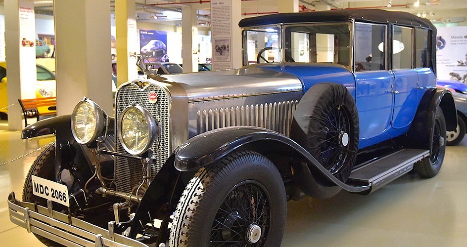 A pristine vintage automobile with polished chrome and classic lines on display at Gee Dee Car Museum in Coimbatore, Tamil Nadu, India, showcasing automotive heritage. A pristine vintage automobile with polished chrome and classic lines on display at Gee Dee Car Museum in Coimbatore, Tamil Nadu, India, showcasing automotive heritage.
