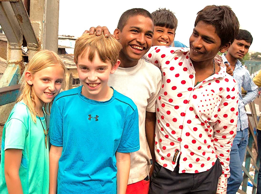 A heartwarming photo of local Indian children and young tourists sharing a smile in Coimbatore, Tamil Nadu, India. Such friendly encounters are common for families visiting popular attractions like the Geedee Car Museum while on holiday from nearby hill stations like Kodaikanal and Ooty. A heartwarming photo of local Indian children and young tourists sharing a smile in Coimbatore, Tamil Nadu, India. Such friendly encounters are common for families visiting popular attractions like the Geedee Car Museum while on holiday from nearby hill stations like Kodaikanal and Ooty.