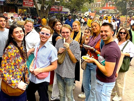 In India’s New Delhi, lively tourists queue outside Gurudwara Bangla Sahib Sikh Temple enjoying langar meals, capturing cross-cultural exchange, spiritual pilgrimage, heritage architecture, community service, vibrant devotion, welcoming sacred tradition. In India’s New Delhi, lively tourists queue outside Gurudwara Bangla Sahib Sikh Temple enjoying langar meals, capturing cross-cultural exchange, spiritual pilgrimage, heritage architecture, community service, vibrant devotion, welcoming sacred tradition.