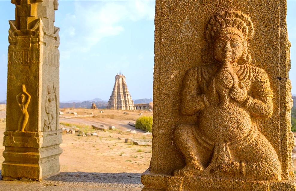 Intricate stone carvings on a pillar at the Hampi UNESCO site in Karnataka, India, with the Vittala Temple and Elephant Stables being other key monuments in this historic area.