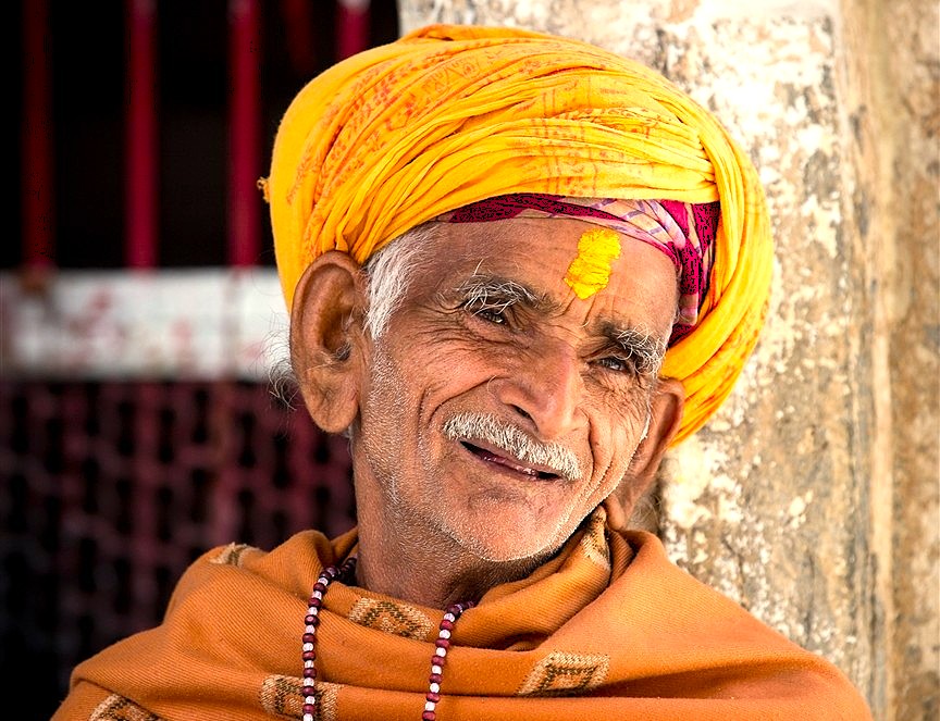 A portrait of an elderly local man in Hampi, Karnataka, India, representing the living culture of the UNESCO site, home to the Vittala Temple and the Elephant Stables.